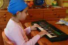 Jamie got a new swimming cap and insisted on wearing it whilst playing the keyboard.