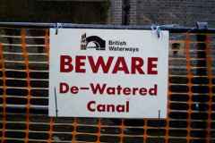 That sign. There is no such word as de-watered.